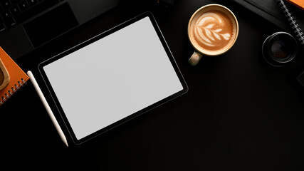 Workspace with mock up digital tablet, coffee cup and office supplies