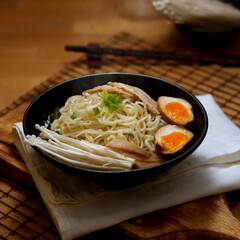 Traditional Japan noodle, Tonkotsu ramen with sliced pork and eggs and pork bone based soup