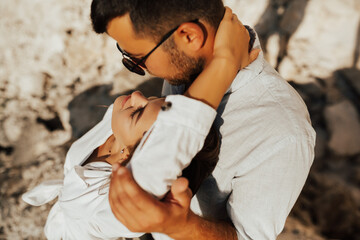 Obraz premium Close-up cropped portrait of couple. Attractive passionate charming bearded guy and tender lady looking each other with passion.