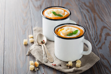 Vegetarian autumn pumpkin cream soup with seeds