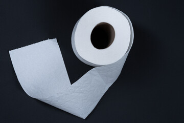 Toilet roll on black background