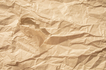 Fototapeta premium Brown crumpled paper close up texture background