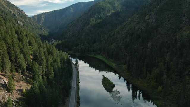Floating Aerial View of Washington State Scenic Mountain Highway by Water Reflection