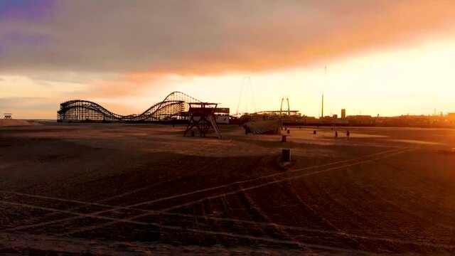 drone footage of beach at sunset.
