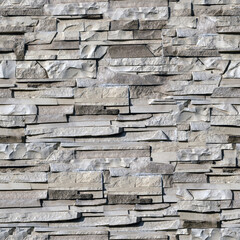 Сlinker tiles or bricks on the wall in the form of wild stone. Seamless texture