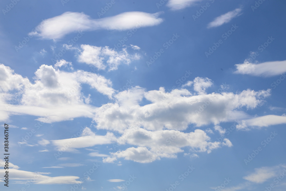 Wall mural blue sky with fluffy clouds, background