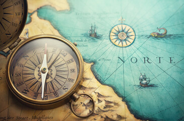 Fototapeta na wymiar Magnetic old compass on world map.Travel, geography, navigation, tourism and exploration concept background. Treasure Island on the Pirate Map.