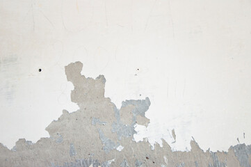 paint peels off the wall. peeling paint background. plaster walls. building construction and...