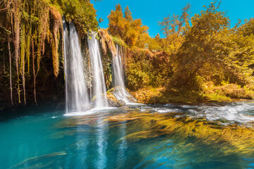 The upper Dyuden waterfall is a unique natural wonder not far from the center of Antalya. Golden soft light in early autumn in Turkey