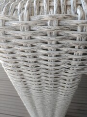 Fototapeta na wymiar White wicker chair close-up, texture