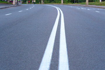 Fototapeta na wymiar Turn on the road. The highway with a white marking.