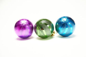 Blue, green and purple Christmas balls on a white background, New Year, Christmas toys, holiday, Christmas.