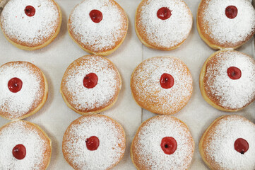 Hanukkah symbol jewish food holiday image of donut with jelly and sugar powder.