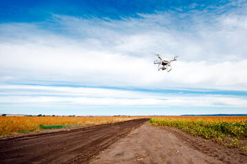 drone quad copter on yellow field