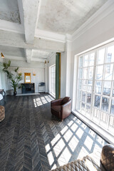 Chic, luxurious guest room design with old-fashioned antique furniture. white walls are decorated with relief. there is a beautiful dark brown parquet on the floor.