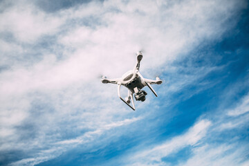 drone flying over the blue sky background
