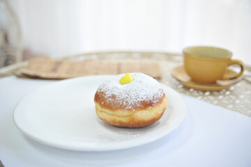 Obraz na płótnie Canvas Hanukkah symbol jewish food holiday image of donut with egg jelly and sugar powder.