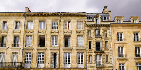 Fototapeta na wymiar large ancient building facade typical of Bordeaux city center