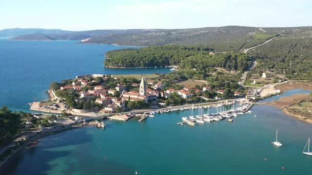 Beautiful old historic town of Osor, marina and bridge connecting islands Cres and Losinj, Croatia, aerial footage from drone