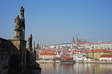 Prague historic city center with castle, panoramic view from Charles Bridge across Vltava River