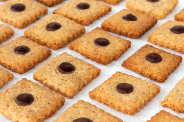 Cookies with almonds on a white background. Selective focus.