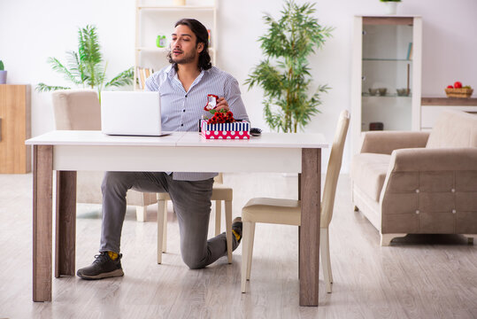 Young man doing marriage proposal via internet