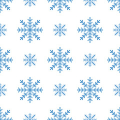 The seamless pattern with the big and small blue snowflakes is on the white background.