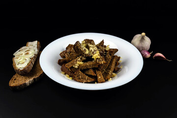 Homemade black bread croutons with garlic and cheese