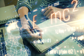 Science formula hologram over woman's hands taking notes background. Concept of study. Double exposure