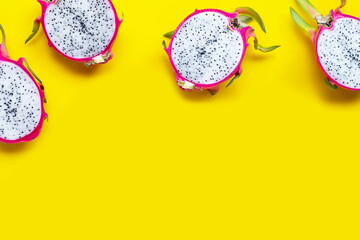 Dragon fruit or pitaya on yellow background.