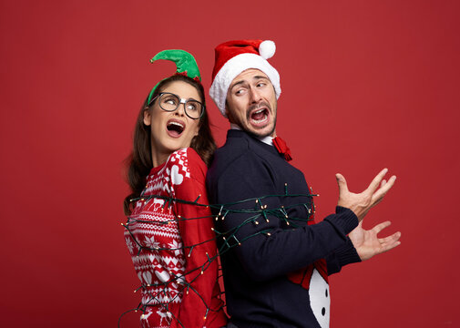 Couple Trapped In The Bond Of Christmas Lights