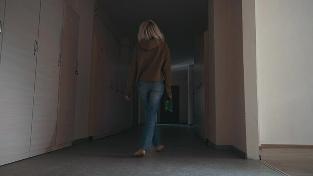 Miserable woman in depression, drinking alcohol