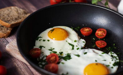 
Fried eggs in a frying pan.