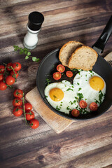 
Fried eggs in a frying pan.
