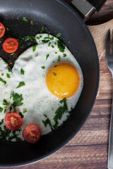 
Fried eggs in a frying pan.