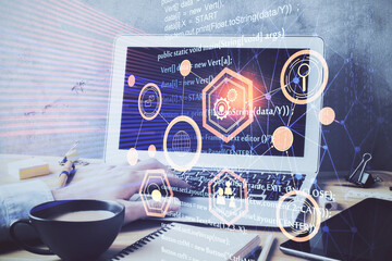Fototapeta premium Double exposure of data internet theme hologram with man working on computer on background. Concept of innovation.