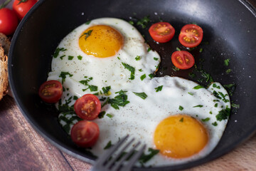 
Fried eggs in a frying pan.