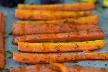 Grilled carrots and cauliflower with aromatic herbs and olive oil.  Mediterranean diet.