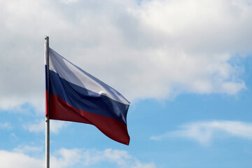 The Russian flag, the tricolor waving on the wind