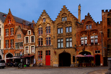 Fototapeta premium Bruges, Flanders, Belgium, Europe - October 1, 2019. Bruges, Flanders, Belgium, Europe - October 1, 2019. Medieval old brick houses on the ancient streets in Bruges (Brugge) in autumn