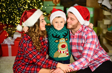 Happy holidays. Spend time with family. Parents and child christmas eve. Christmas tradition. Father and mother with cute son christmas tree background. Idyllic moment. Family values. Boxing day