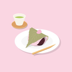 cup of Japanese green tea and Sakura mochi with a cherry petal on a plate