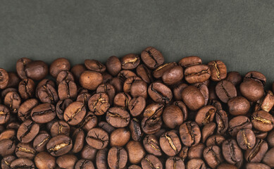 coffee beans closeup on the dark background, top view