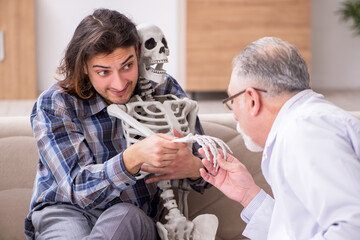 Young male patient visiting experienced doctor psychiatrist