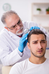 Young man visiting experienced doctor dermatologist