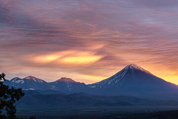 Fototapeta premium Kamchatka, volcanoes Arik and Koryaksky at sunrise