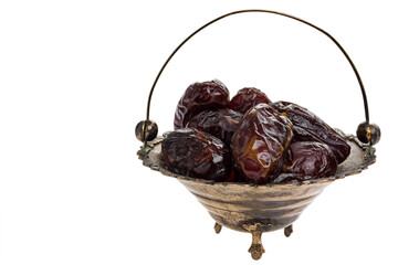 dried fruits in retro brass bowl isolated on white background