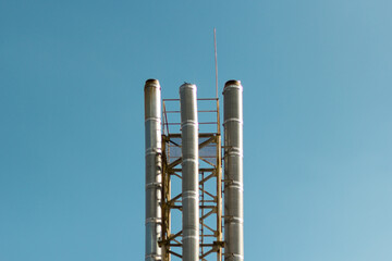 Pipes from the boiler room on a background of sky.