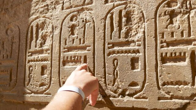 Wall of the Sanctuary For Sacrifices for God Amon-Ra, His Wife Mut and Son Khonsu, Built by the Pharaoh of the XIX Dynasty Seti II. Tourists Study History of Egypt in Karnak Temple