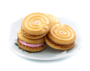 Fototapeta na wymiar sandwich cookies with strawberry cream on white background